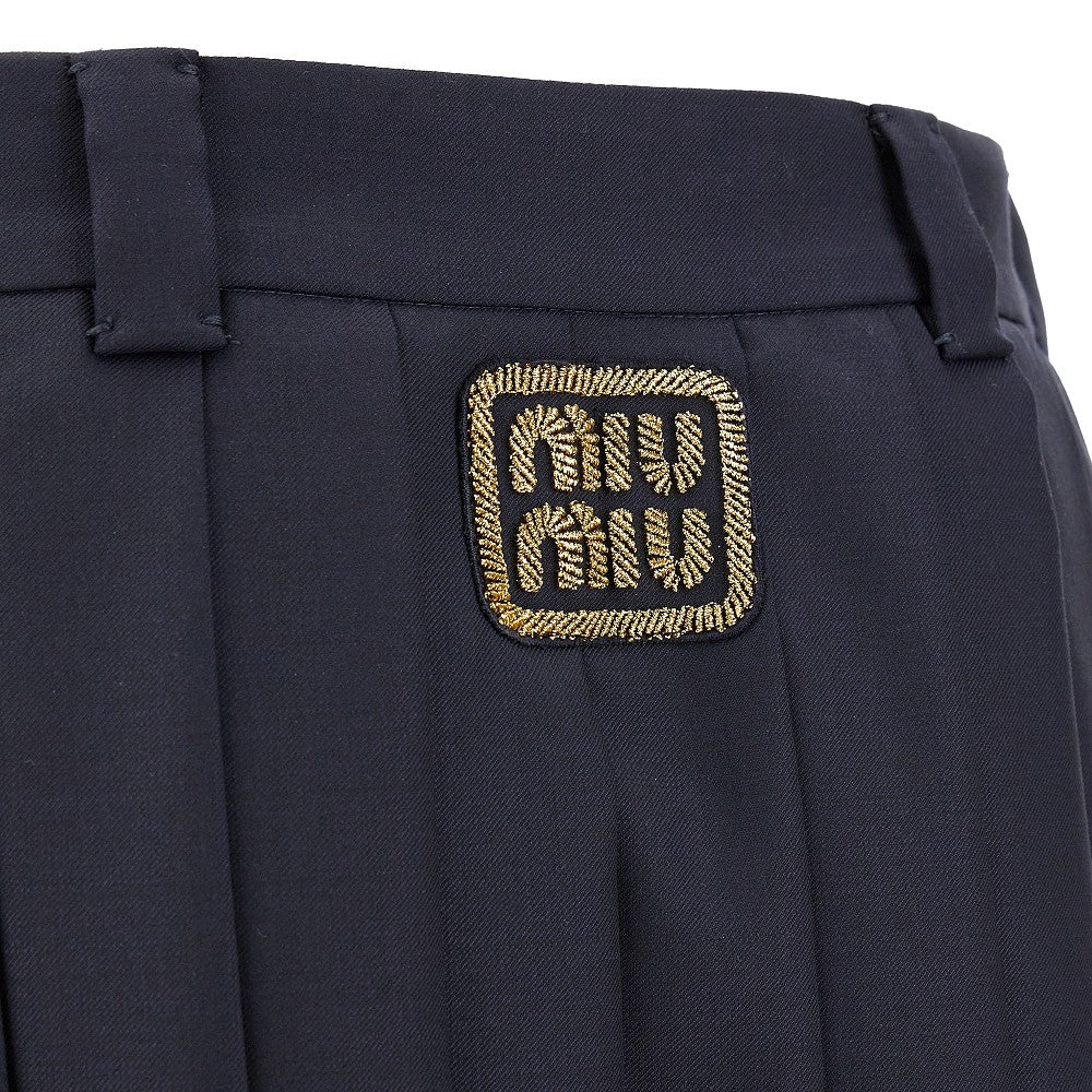 Pleated mini skirt with logo patch