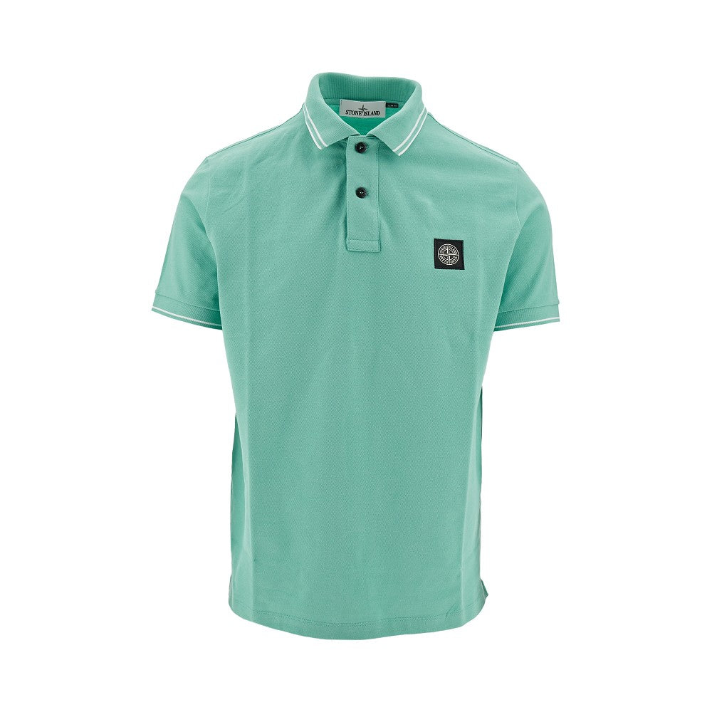 Polo in piquet stretch con patch logo