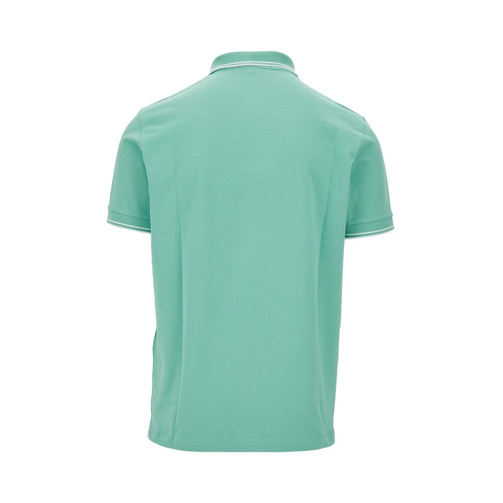 Polo in piquet stretch con patch logo