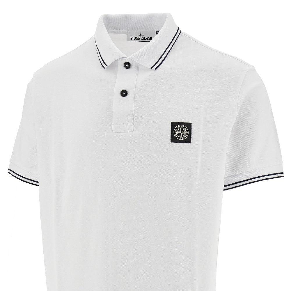 Polo in piquet stretch con patch logo