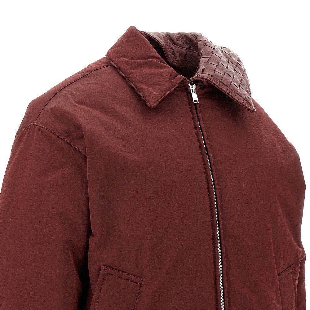 Down jacket with Intrecciato leather collar